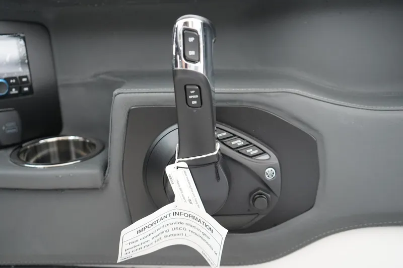 Slide: The Image of 2026 Chaparral 270 OSX boat throttle control with informational tag and dashboard details. - 15