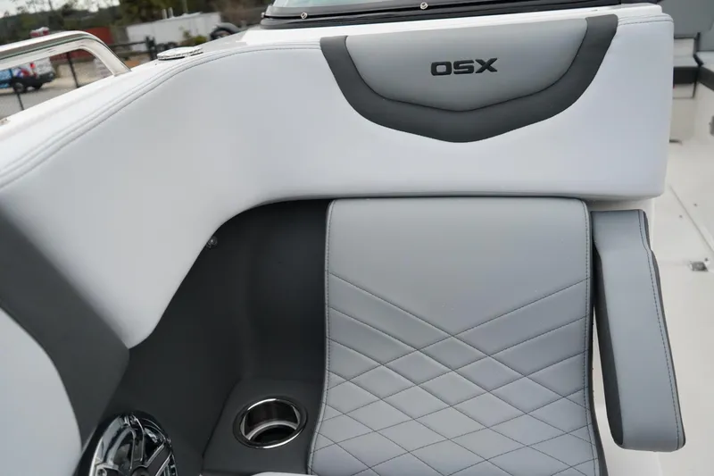 Slide: The Image of 2026 Chaparral 270 OSX boat interior with sleek gray seating and cup holder. - 21