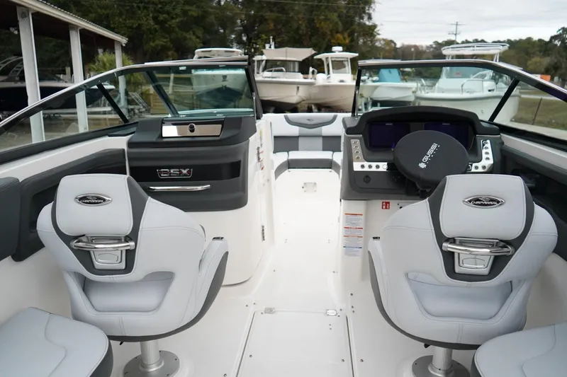 Slide: The Image of 2026 Chaparral 270 OSX boat interior with modern seating and dashboard. - 27