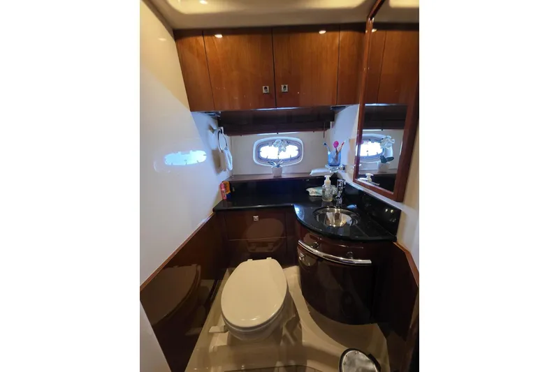 Slide: The Image of Luxurious bathroom in 2010 Sea Ray 470 Sundancer yacht with elegant wood cabinetry. - 5