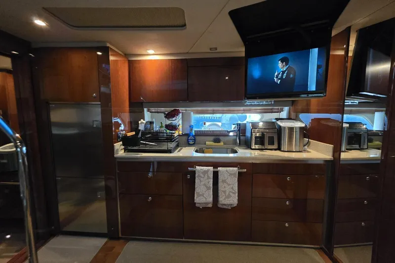 Slide: The Image of Luxurious kitchen interior of 2010 Sea Ray 470 Sundancer yacht with modern appliances. - 7