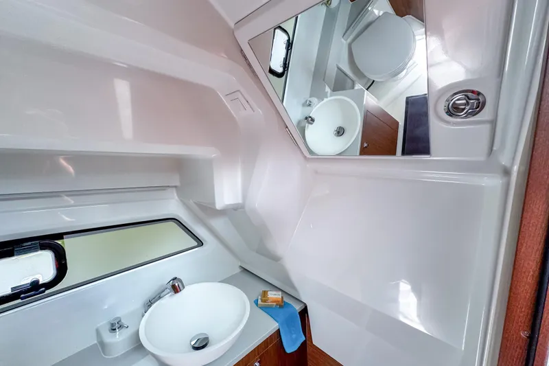 Slide: The Image of Modern bathroom interior of 2026 Beneteau Antares 9 boat with sink and mirror. - 24