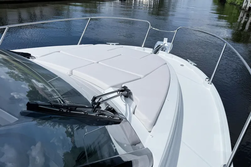 Slide: The Image of 2026 Beneteau Antares 9 boat deck with sleek design and comfortable seating. - 27