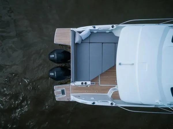 Slide: The Image of Top view of 2024 Beneteau Antares 9 boat with twin outboard motors. - 9