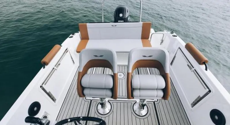 Slide: The Image of 2025 Beneteau Flyer 7 SPACEdeck boat interior with dual seats and sleek design. - 7