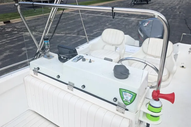 Slide: The Image of 1999 Cape Horn 17' Center Console boat interior with steering wheel and seating. - 14