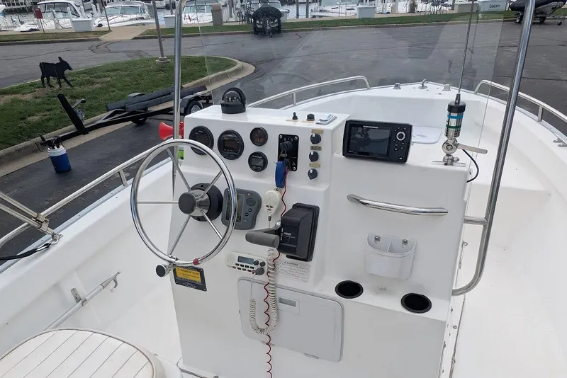 Slide: The Image of 1999 Cape Horn 17' Center Console boat dashboard with steering wheel and navigation equipment. - 6
