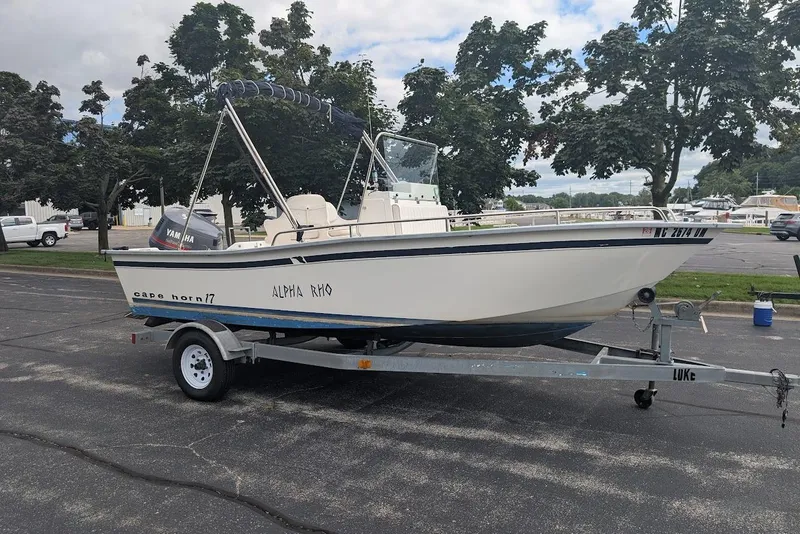 Slide: The Image of 1999 Cape Horn 17' Center Console boat on trailer, parked outdoors. - 1