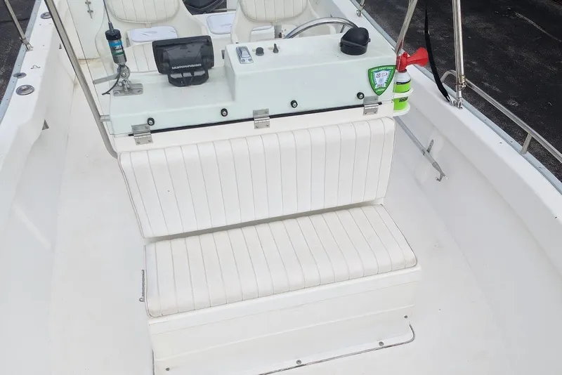 Slide: The Image of 1999 Cape Horn 17' Center Console boat interior with white seating and control panel. - 12