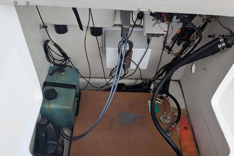 Slide: The Image of Interior view of a 1999 Cape Horn 17' Center Console boat showing wiring and components. - 13