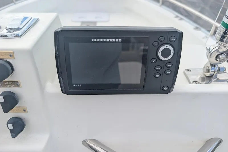Slide: The Image of Humminbird Helix 5 fish finder on 1999 Cape Horn 17' Center Console boat dashboard. - 16