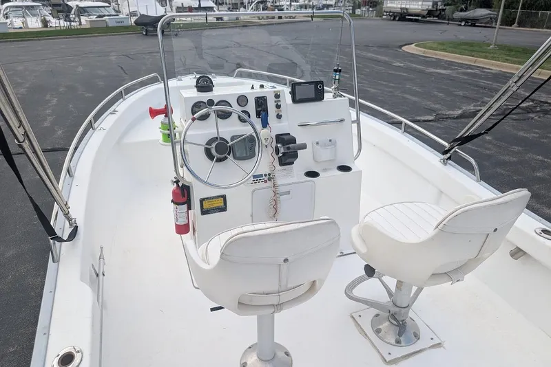 Slide: The Image of 1999 Cape Horn 17' Center Console boat with steering wheel and seating. - 17