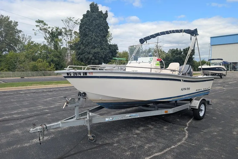 Slide: The Image of 1999 Cape Horn 17' Center Console boat on trailer, parked outdoors. - 9