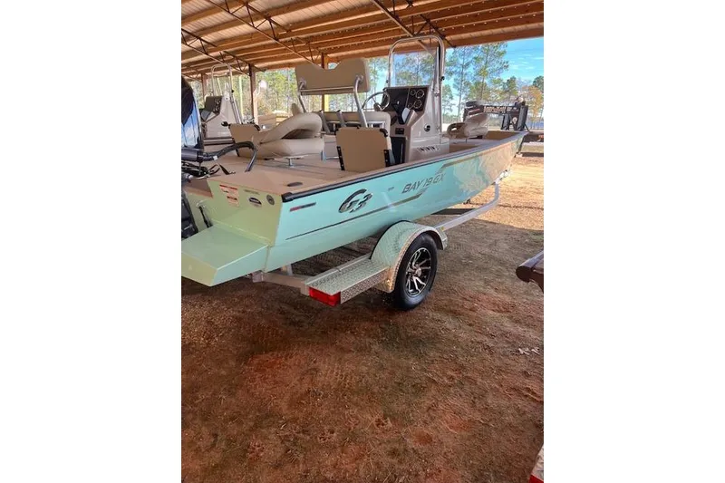 The Image of 2024 G3 Bay 20 GX boat on trailer in covered storage area. - 3