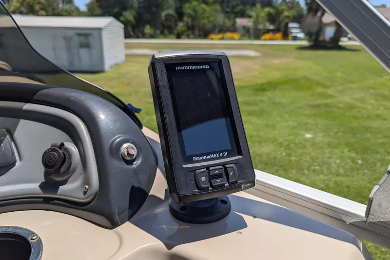Slide: The Image of Fish finder on 2019 Sun Tracker Fishin' Barge 24 DLX dashboard in sunny outdoor setting. - 12