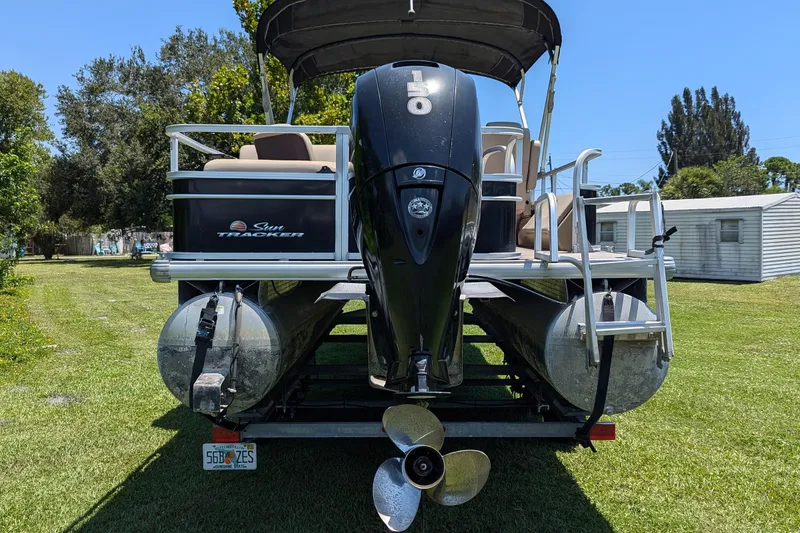 Slide: The Image of 2019 Sun Tracker Fishin' Barge 24 DLX pontoon boat with powerful outboard motor. - 5