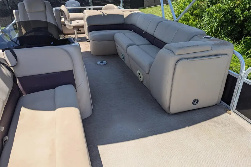 Slide: The Image of 2019 Sun Tracker Fishin' Barge 24 DLX interior with spacious seating and modern design. - 9