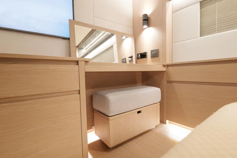 Slide: The Image of Luxurious 2027 Pardo Yachts GT75 deck with elegant seating and wooden table. - 16