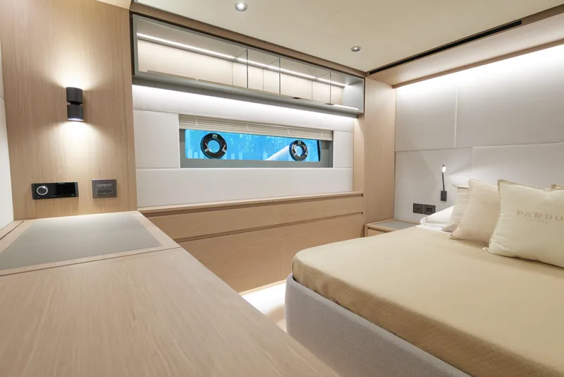 Slide: The Image of Luxurious 2027 Pardo Yachts GT75 deck with elegant seating and waterfront city view. - 17