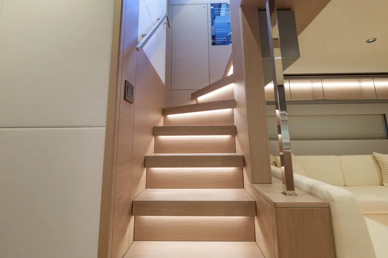 Slide: The Image of Luxurious 2027 Pardo Yachts GT75 with spacious deck seating, overlooking waterfront cityscape. - 27