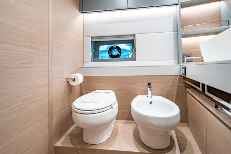 Slide: The Image of Luxurious bathroom in 2027 Pardo Yachts GT75, featuring modern toilet and bidet. - 63