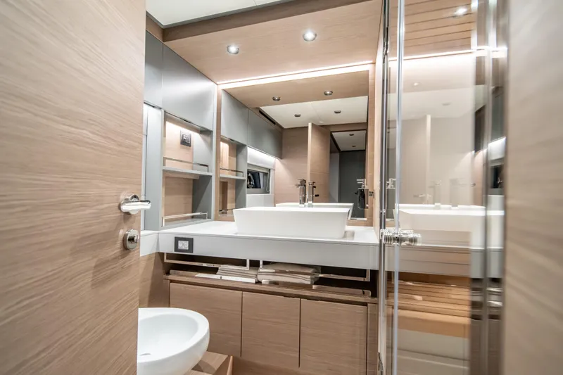 Slide: The Image of Luxurious bathroom interior of 2027 Pardo Yachts GT75, featuring modern fixtures and elegant wood finishes. - 47