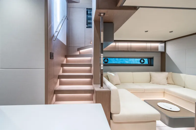 Slide: The Image of Luxurious interior of 2027 Pardo Yachts GT75 with modern staircase and elegant seating area. - 53