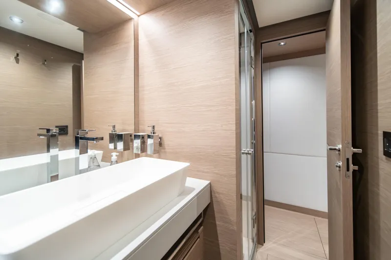 Slide: The Image of Luxurious bathroom interior on 2027 Pardo Yachts GT75, featuring modern sink and fixtures. - 55