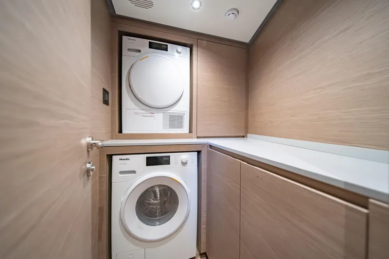 Slide: The Image of Laundry area with washer and dryer in 2027 Pardo Yachts GT75. - 57