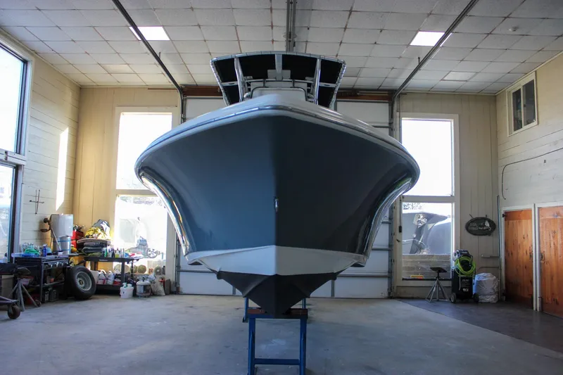 Slide: The Image of 2018 Key West 219 FS boat in a spacious indoor garage. - 10