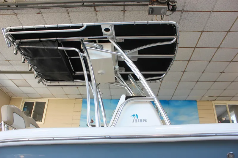 Slide: The Image of 2018 Key West 219 FS boat with T-top in indoor showroom. - 12
