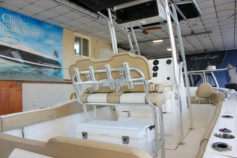 Slide: The Image of 2018 Key West 219 FS boat interior with seating and control panel in showroom. - 15