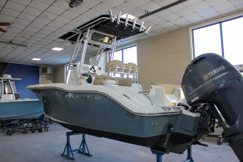 Slide: The Image of 2018 Key West 219 FS boat with Yamaha engine in showroom. - 2