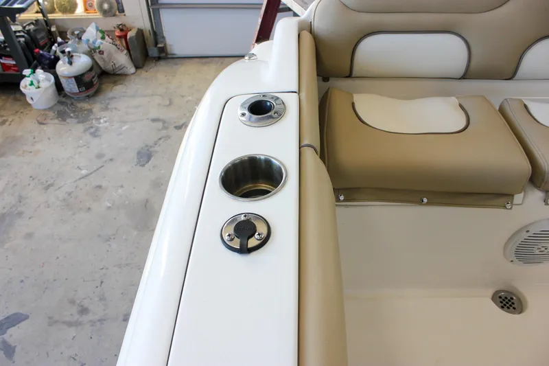 Slide: The Image of Interior of 2018 Key West 219 FS boat with beige seating and cup holders. - 20