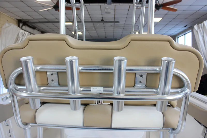 Slide: The Image of 2018 Key West 219 FS boat seat with rod holders in a showroom. - 27