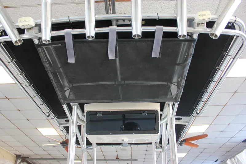 Slide: The Image of 2018 Key West 219 FS boat T-top with rod holders and storage compartment. - 28