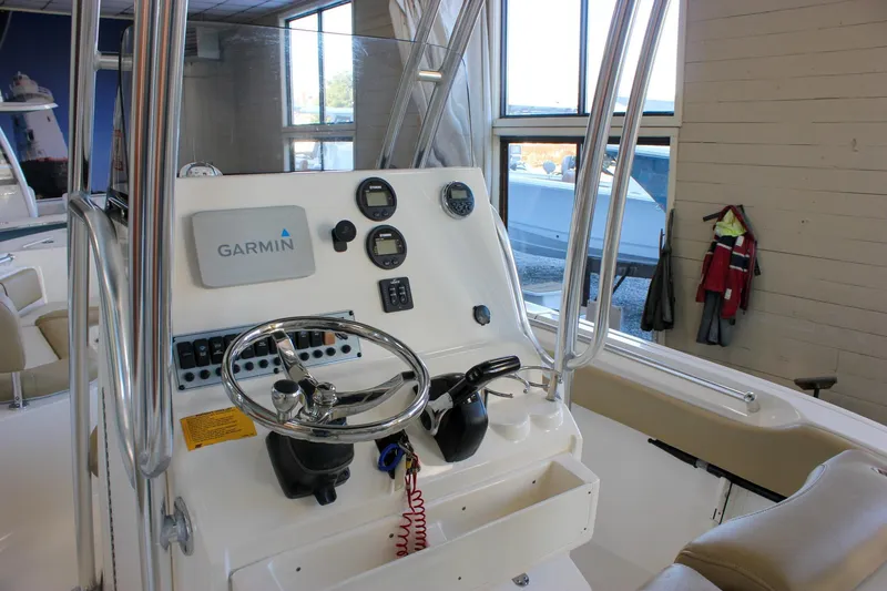 Slide: The Image of 2018 Key West 219 FS boat console with Garmin navigation system and steering wheel. - 29