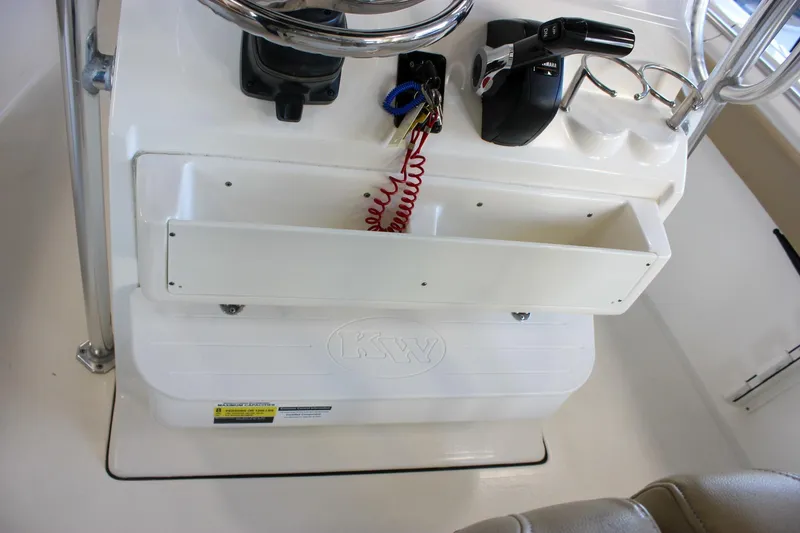 Slide: The Image of 2018 Key West 219 FS boat console with steering wheel and controls. - 30