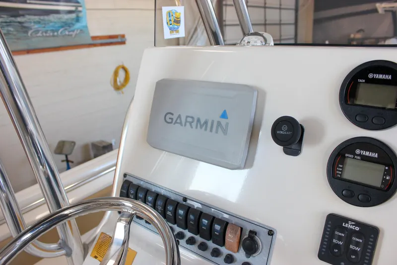 Slide: The Image of 2018 Key West 219 FS boat dashboard with Garmin navigation and Yamaha gauges. - 34