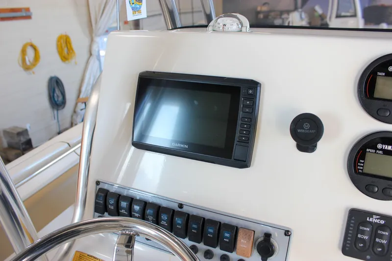 Slide: The Image of Dashboard of 2018 Key West 219 FS boat with Garmin display and controls. - 35