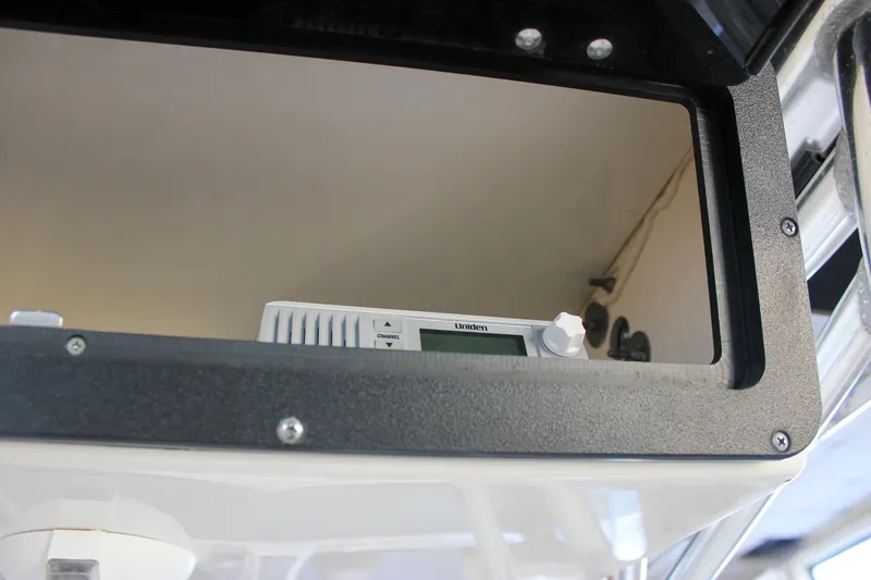 Slide: The Image of 2018 Key West 219 FS boat console with Uniden radio equipment. - 37