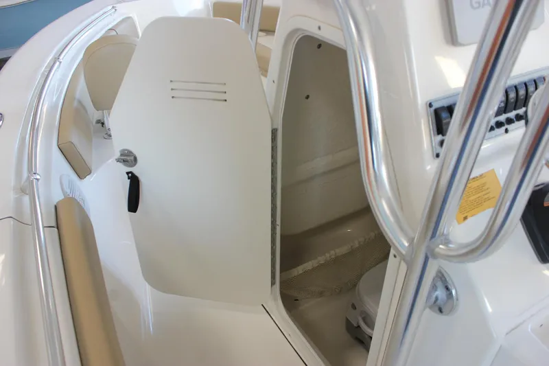 Slide: The Image of 2018 Key West 219 FS boat interior with open storage compartment and seating. - 38