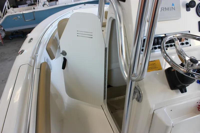 Slide: The Image of 2018 Key West 219 FS boat interior with steering wheel and console details. - 39