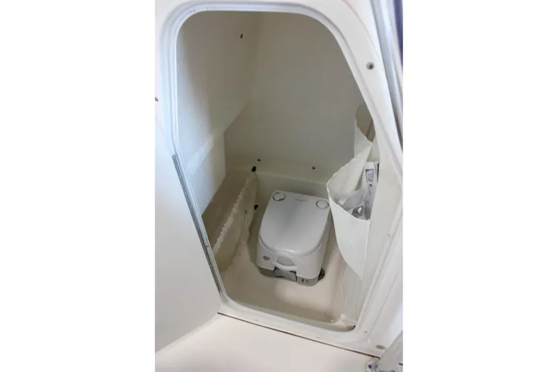 Slide: The Image of 2018 Key West 219 FS boat interior with compact marine toilet. - 40
