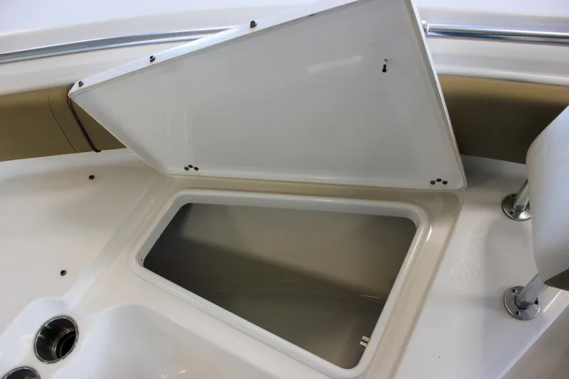 Slide: The Image of Open storage compartment on 2018 Key West 219 FS boat, featuring sleek white interior. - 51