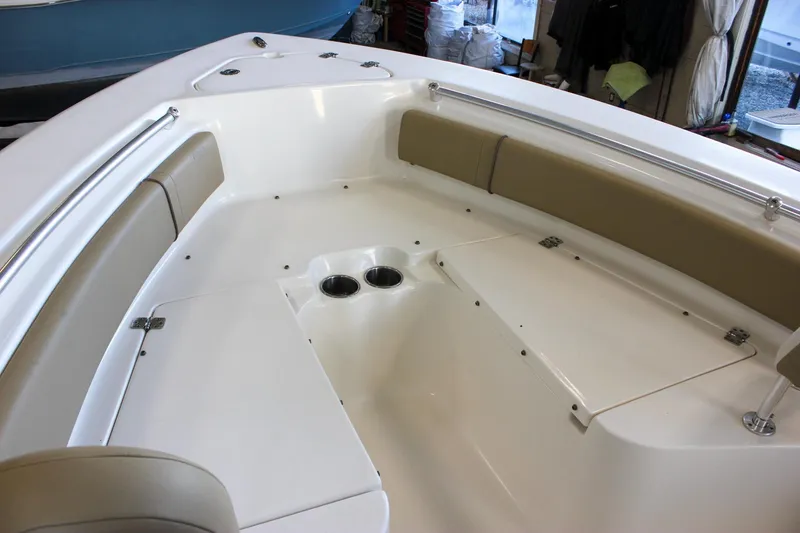 Slide: The Image of 2018 Key West 219 FS boat interior with cushioned seating and cup holders. - 53