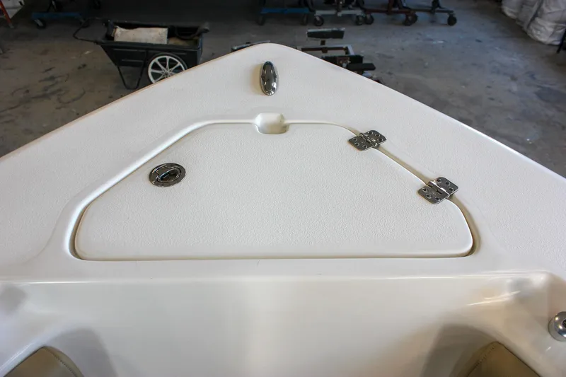 Slide: The Image of Bow storage compartment of 2018 Key West 219 FS boat in a garage setting. - 55