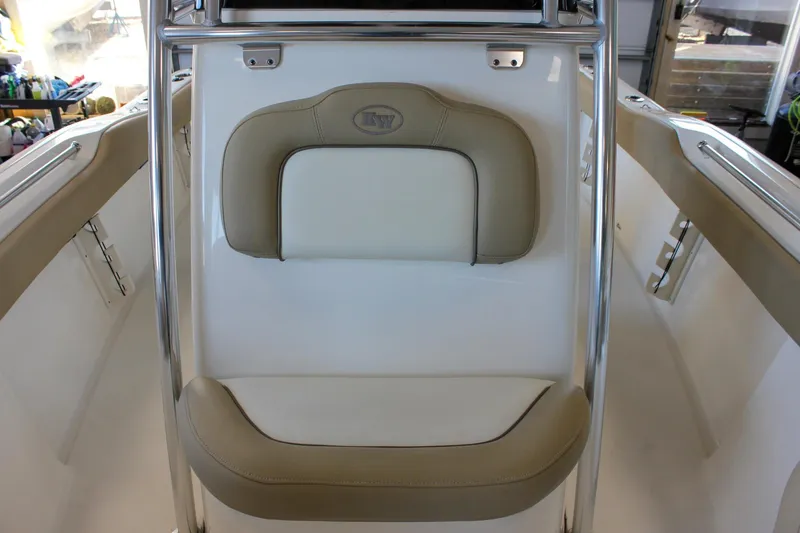 Slide: The Image of 2018 Key West 219 FS boat interior with beige seating and stainless steel rails. - 56