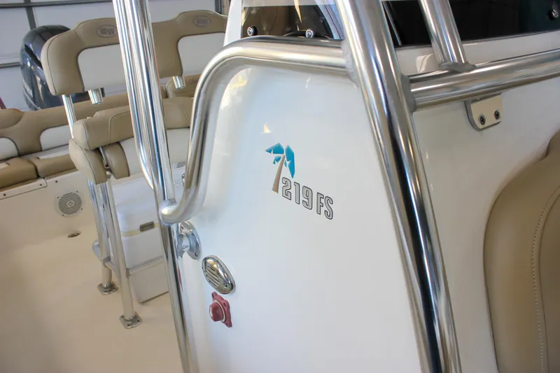 Slide: The Image of 2018 Key West 219 FS boat interior with seating and stainless steel details. - 57