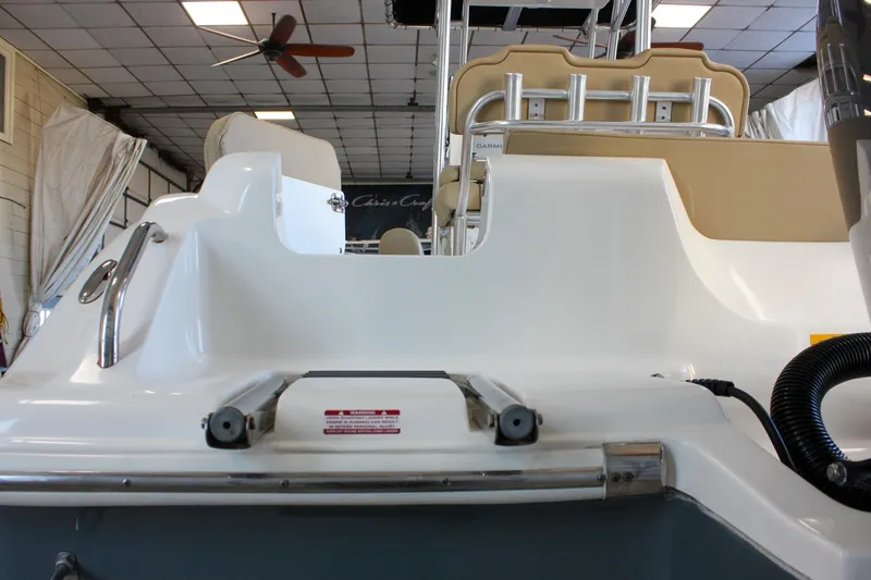 Slide: The Image of 2018 Key West 219 FS boat interior with seating and equipment in showroom. - 6